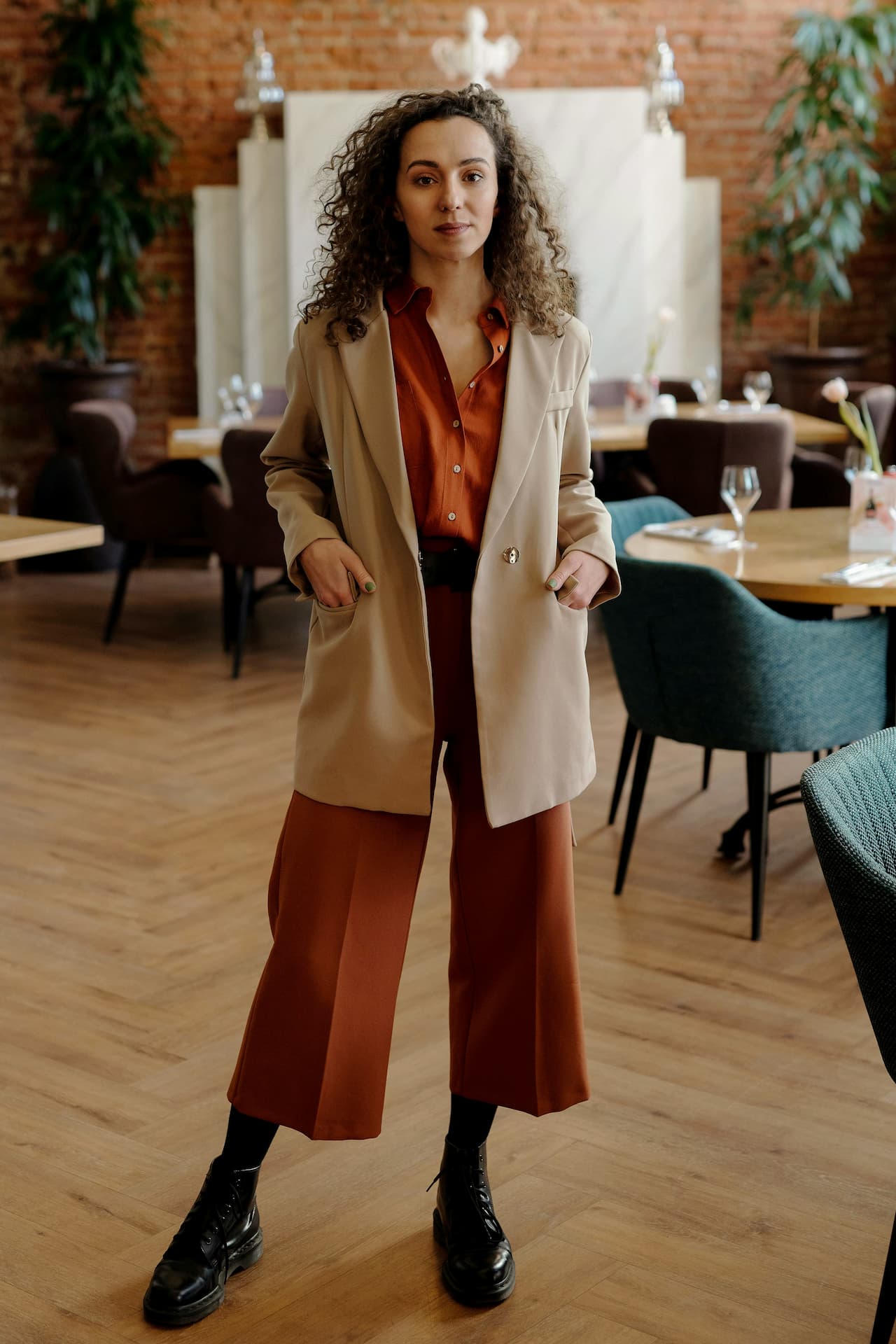 A member at Apollo, in a warm brick-and-timber workspace